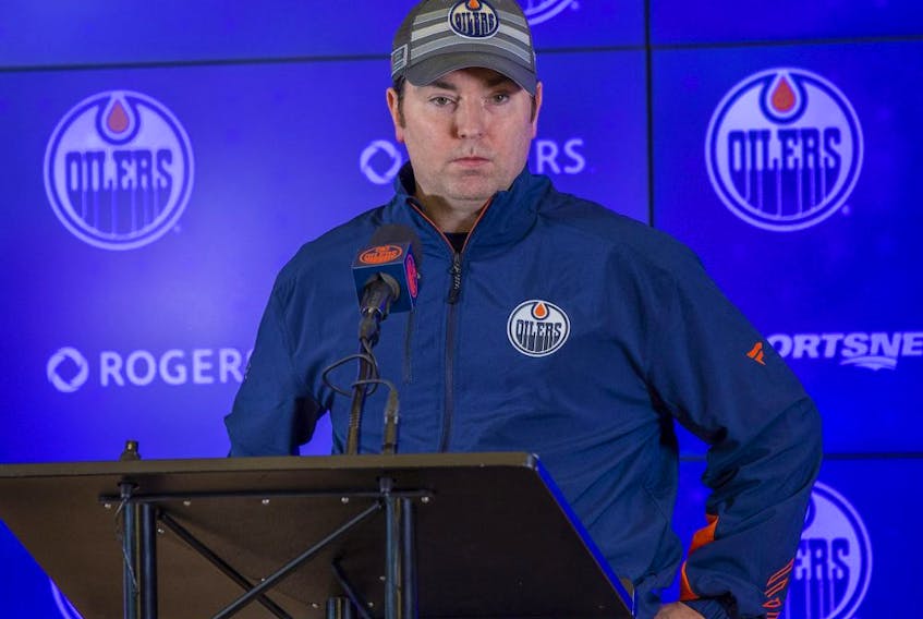 New Oilers head coach Jay Woodcroft fields questions following his first practice with the team on Feb. 11, 2022, in Edmonton.  