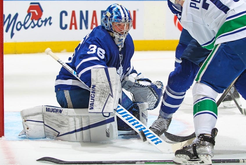 Maple Leafs goalie Jack Campbell makes a save against the Vancouver Canucks during on Saturday night at Scotiabank Arena. Campbell allowed five goals on 28 shots in a 6-4 Toronto loss.