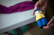  Multiple large bags of small, hand-knit dolls like this one were also donated Saturday.