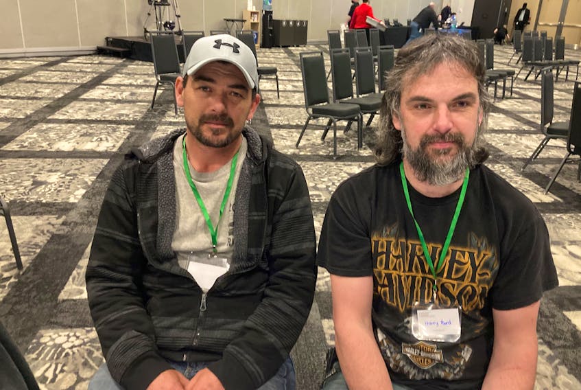 Brothers Cory and Harry Bond, whose parents were killed in Portapique on the night of April 18, 2020, attend the Mass Casualty Commission public inquiry at the Halifax Trade Centre on Monday, March 7, 2022.
