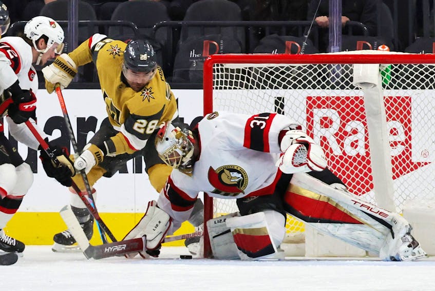 Ottawa Senators goalie Anton Forsberg defends his net against William Carrier of the Vegas Golden Knights on Sunday at T-Mobile Arena. Forsberg made 40 save in his team's 2-1 loss.