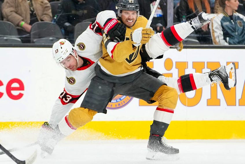  Ottawa Senators left wing Zach Sanford (13) and Vegas Golden Knights defenceman Shea Theodore (27) are pictured during the first period at T-Mobile Arena.