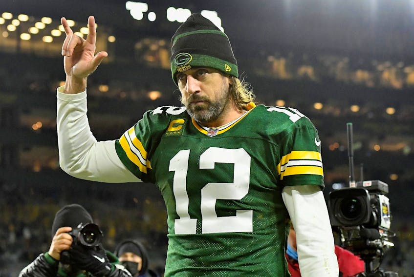 Aaron Rodgers #12 of the Green Bay Packers reacts as he walks off the field following the 45-30 victory over the Chicago Bears in the NFL game at Lambeau Field on December 12, 2021 in Green Bay, Wisconsin.  