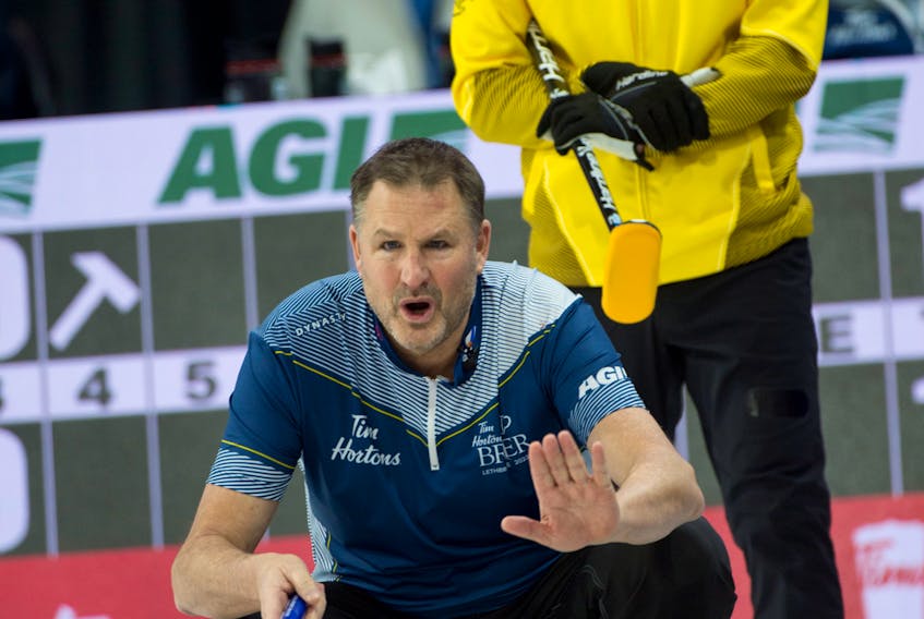 Nova Scotia skip Paul Flemming halts his front during Draw 10 play at the Tim Hortons Brier on Tuesday morning. Flemming suffered his first loss at the national men’s curling championship, a a 7-4 decision to Manitoba’s Mike McEwen. - CURLING CANADA