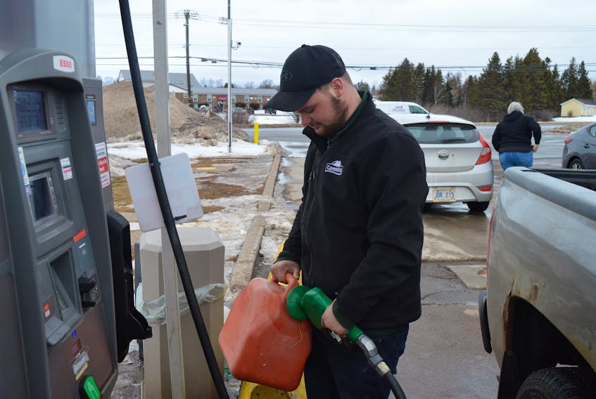 Bryden Dockendorff of Cornwall fills up a jerry can with furnace oil at the Queens Arms Esso on Capital Drive in Charlottetown on March 8.