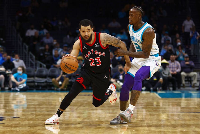Fred VanVleet of the Toronto Raptors dribbles the ball as Terry Rozier of the Charlotte Hornets defends.