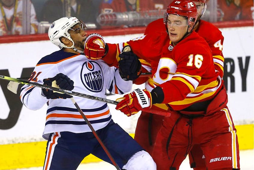 Calgary Flames Nikita Zadorov battles Edmonton Oilers Evander Kane in second period NHL action at the Scotiabank Saddledome in Calgary on Monday, March 7, 2022. Darren Makowichuk/Postmedia