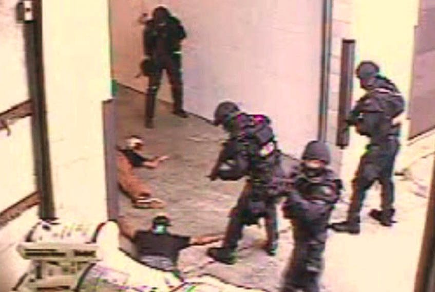  Toronto 18 members Saad Gaya and Saad Khalid lie on the ground during their arrest on June 2, 2006 on charges of taking part a terrorist plot, in this image taken from a video. The two men both pleaded guilty after their arrest.