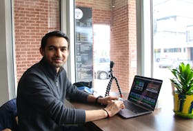 Apurva Patel edits a video for his YouTube channel at Alambé Coffee in Charlottetown. Patel doesn’t use an expensive camera, just his iPhone and Go-Pro. 