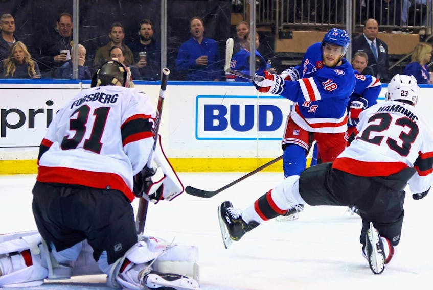 Andrew Copp of the New York Rangers scores his second-period goal against the Ottawa Senators on Saturday. 
