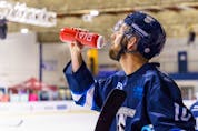  David Babin stops for a drink at the recreation centre rink in Chestermere on Tuesday, April 5, 2022. The hockey marathon is raising money for the Alberta Children’s Hospital Foundation.