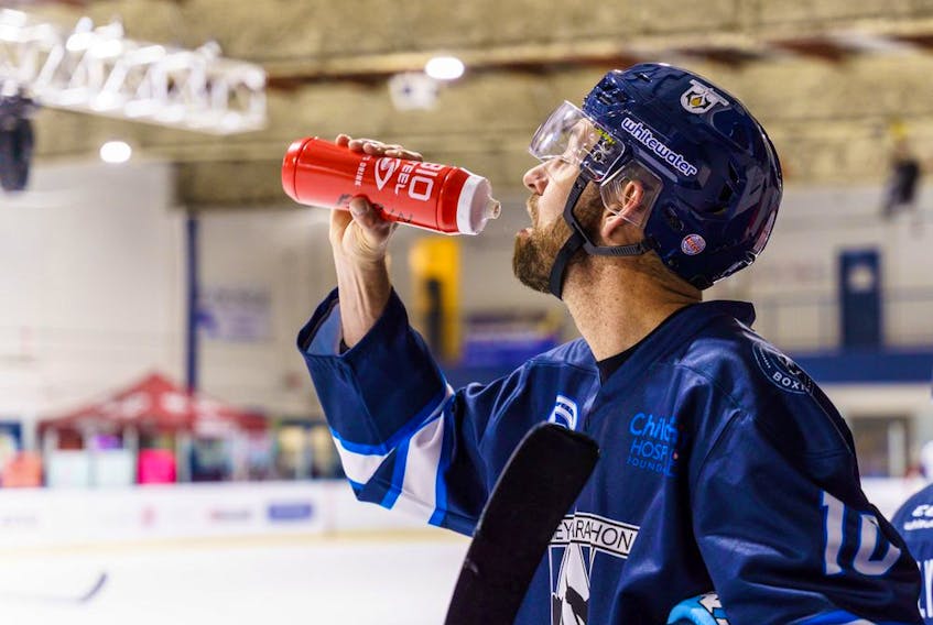 David Babin stops for a drink at the recreation centre rink in Chestermere on Tuesday, April 5, 2022. The hockey marathon is raising money for the Alberta Children’s Hospital Foundation.