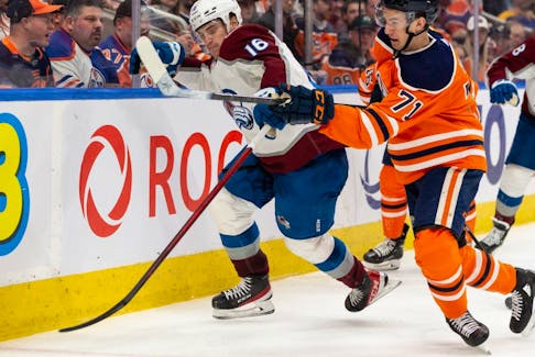 Edmonton Oilers’ Ryan McLeod (71) battles Colorado Avalanche’s Nicolas Aube-Kubel (16) during third period NHL action at Rogers Place in Edmonton, on Saturday, April 9, 2022.
