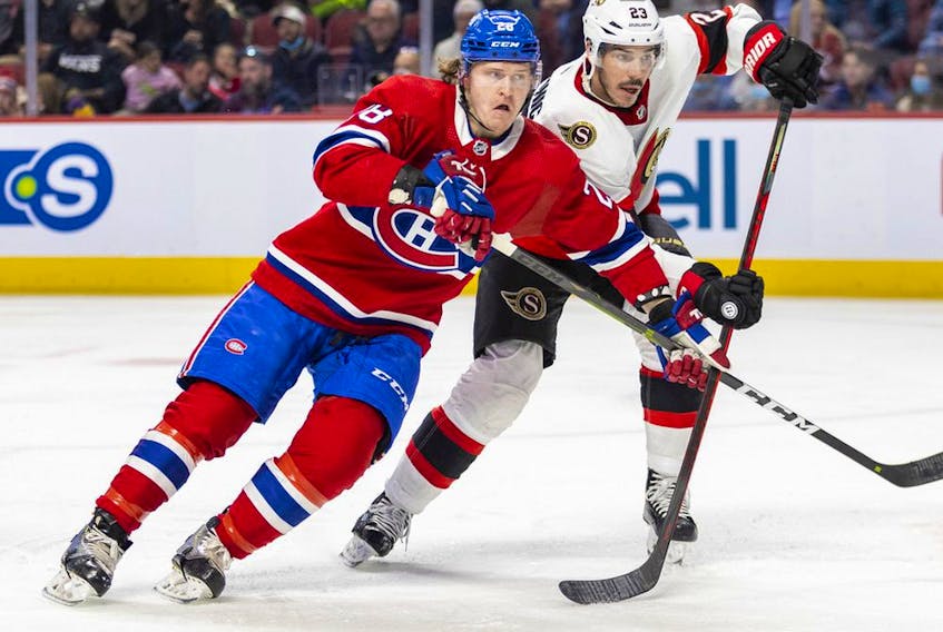 Montreal Canadiens centre Christian Dvorak competes against Ottawa Senators' Travis Hamonic during third period in Montreal on April 5, 2022.