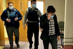 Jainish Sureshkuma Patel, right, leaves the courtroom ahead of a sheriff's deputy and Halifax Regional Police Det. Const. Trena Gillis on Monday during a break at his sexual assault trial.