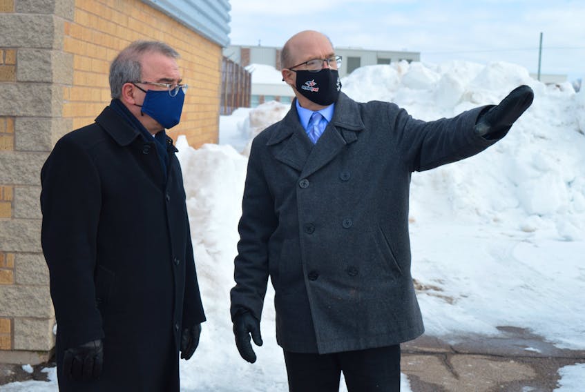 Coun. Terry Bernard, right, chair of Charlottetown council’s parks and recreation committee, talks to Mayor Philip Brown outside Simmons Sport Centre on Feb. 10.