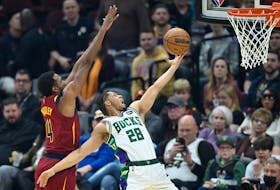 Apr 10, 2022; Cleveland, Ohio, USA; Milwaukee Bucks guard Lindell Wigginton (28) drives to the basket beside Cleveland Cavaliers center Evan Mobley (4) in the first quarter at Rocket Mortgage FieldHouse. Mandatory Credit: David Richard-USA TODAY Sports  Milwaukee Bucks guard Lindell Wigginton (28) drives to the basket against Cleveland Cavaliers centre Evan Mobley in the first quarter of Sunday's NBA game at Rocket Mortgage FieldHouse in Cleveland. - David Richard-USA TODAY Sports