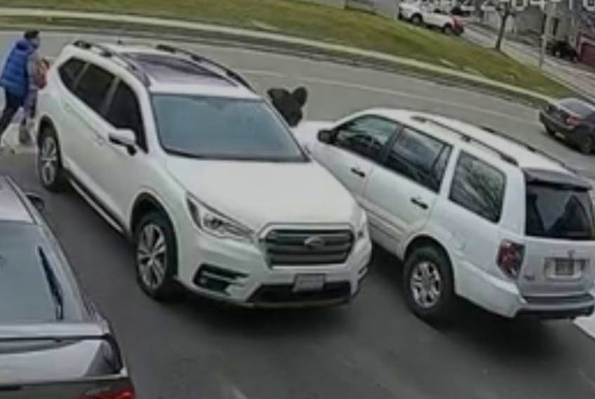  Video footage shows a suspect fleeing from an SUV. REDDIT.COM