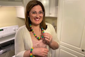 Erin Sulley shows off one-of-a-kind Easter jewelry that is decorative and most definitely fit to eat. – Paul Pickett photo