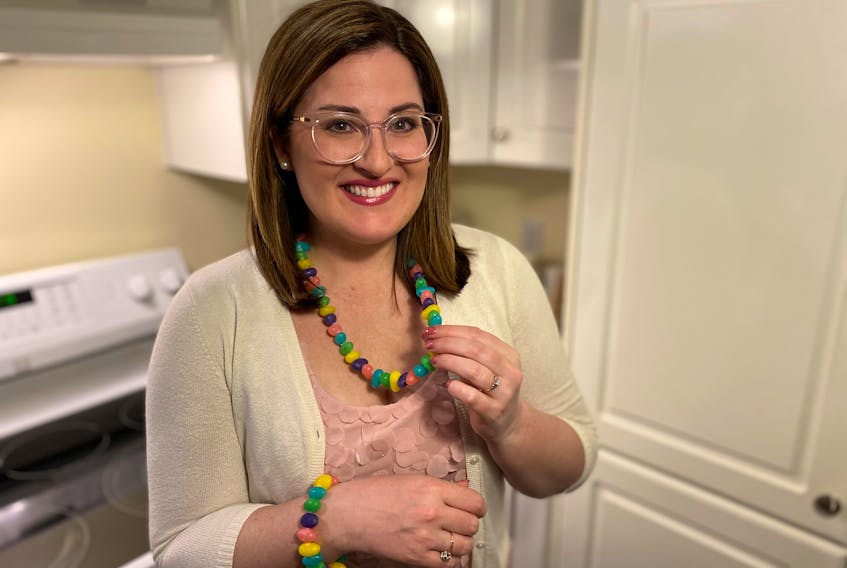 Erin Sulley shows off one-of-a-kind Easter jewelry that is decorative and most definitely fit to eat. – Paul Pickett photo