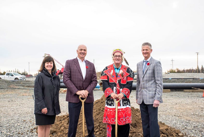Paula MacNeil, Cape Breton Regional Hospital Foundation CEO, left, Mike McPhee, Cancer Care Here at Home campaign chair, Membertou Chief Terry Paul and foundation board chair Stan MacDonald stand on the site of the new Cape Breton Cancer Centre. 