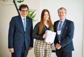 Cape Breton University business student Megan Penney, centre, is flanked by Shannon School of Business dean George Karaphillis, left, and Paul D. Sobey, chair of Sobeys Inc.’s board of trustees. Penney was awarded a Frank H. Sobey scholarship which comes with a prize of $35,000. CONTRIBUTED