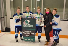 Hockey P.E.I. representative Tish Shea presents the Dalziel Cup to the captains of the Western Wind, from left: Ella Collins, Bridgette Linkletter, Chloe Gallant and Bailey Jones. The Dalziel Cup, which honours the contributions of Susan Dalziel to female hockey in Canada’s smallest province, is presented to the champions of the P.E.I. Under-18 AAA Hockey League.