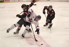 Valley Wildcats forward Cam Henderson tries to spin away from Truro Bearcats defenceman Brandt King during Game 4 of their Maritime Junior Hockey League semifinal at the Kings Mutual Century Centre in Berwick on April 14.