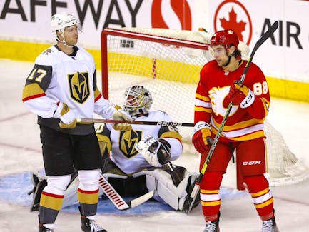 Johnny 'Hockey' hits 100-point milestone in Flames' comeback on Kraken