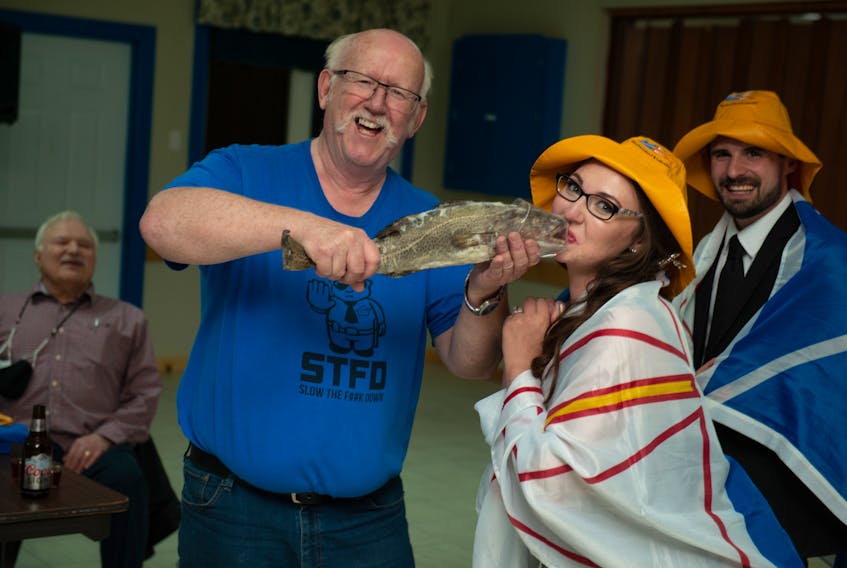 Getting screeched in by three of the people who inspired characters in “Come From Away” was the icing on the cake for Bronwyn Harrell after her theatre inspired wedding in Gander. Oz Fudge, left, a retired municipal enforcement officer, held up the cod for her to kiss.