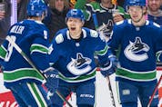  Alex Chiasson #39 of the Vancouver Canucks celebrates with teammates J.T. Miller #9 and Vasily Podkolzin #92 after scoring a goal against the Phoenix Coyotes during the first period at Rogers Arena on April 14, 2022 in Vancouver.
