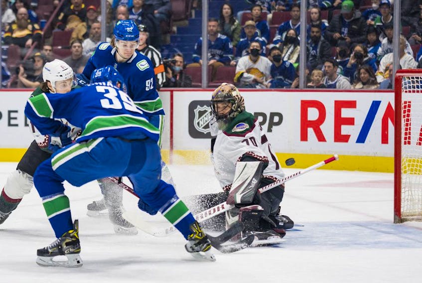  Vancouver Canucks forward Alex Chiasson (39) scores on Arizona Coyotes goalie Karel Vejmelka (70) in the first period at Rogers Arena April 14, 2022.