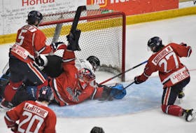 Valley Wildcats goalie Antoine Lyonnais makes a save as Truro Bearcats captain Holden Kodak goes hard to the net during Game 5 of the teams’ Maritime Junior Hockey League semifinal April 16 at the Rath Eastlink Community Centre in Truro.