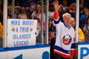 Former New York Islandes Mike Bossy waves to the crowd prior to the game duing Mike Bossy tribute Night  at the Nassau Veterans Memorial Coliseum on January 29, 2015 in Uniondale, New York.   