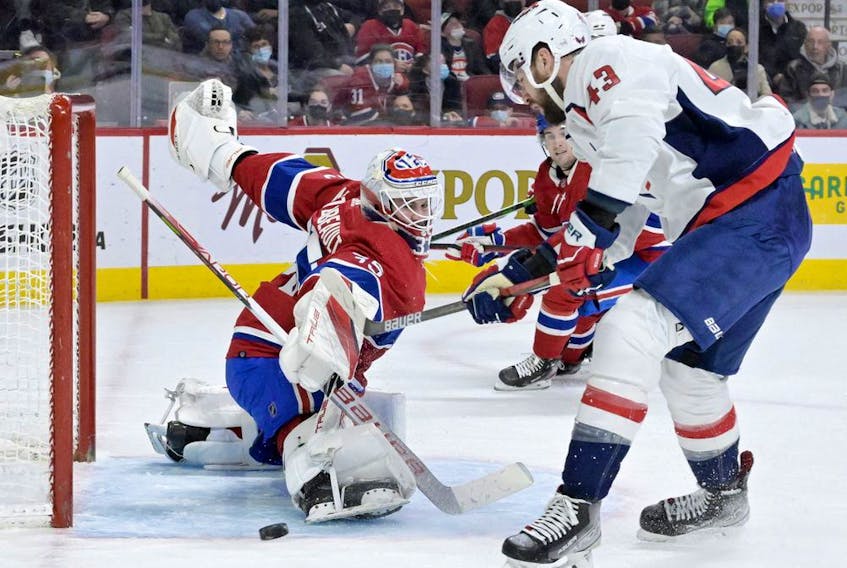Canadiens goalie Sam Montembeault makes a pad save against Washington Capitals' Tom Wilson (43) at the Bell Centre on Saturday, April 16, 2022, in Montreal. 