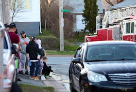 April 18, 2022--Residents of an apartment building at 15 Skeena Street in Fairview watch from across the street as Halifax Fire & Emergency clean up after tackling a small fire in one of the apartments Monday evening.
ERIC WYNNE/Chronicle Herald