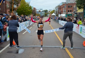 Rachel Barich is all smiles as she crosses the finish line in the 2021 P.E.I. Marathon in Charlottetown. Barich was the second Prince Edward Islander to complete the 26.2-mile course in three hours two minutes 47 seconds (3:02:47). Alex Neuffer (2:21:33) was the first P.E.I. runner to finish.