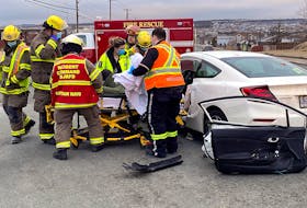 Firefighters used hydraulic extrication tools to free one driver in a two-vehicle crash in Mount Pearl Saturday evening. Keith Gosse/The Telegram