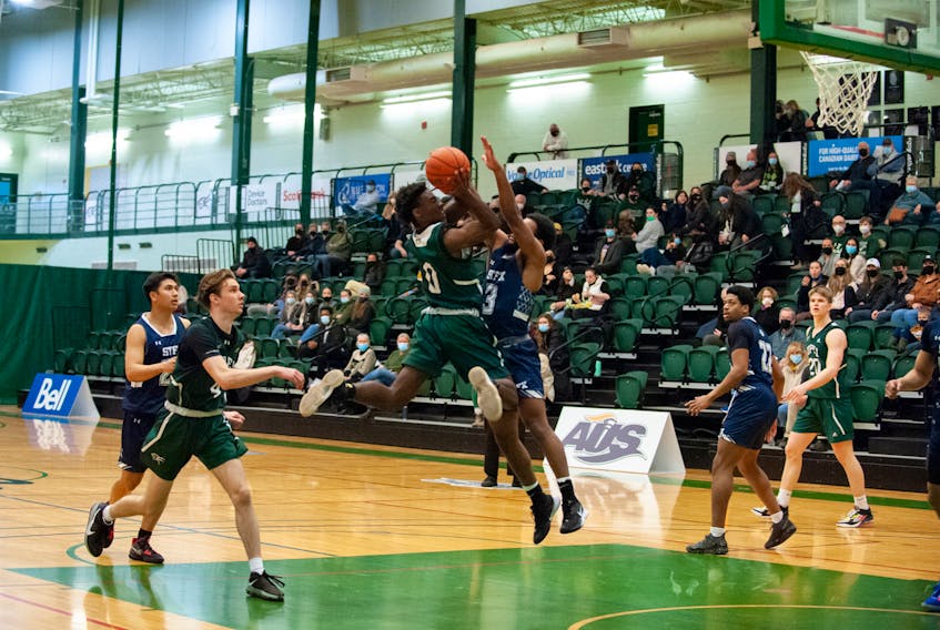 UPEI Panthers point guard Elijah Miller, 0, drives to the basket during an Atlantic University Sport men’s basketball game against the St. Francis Xavier X-Men in Charlottetown during the 2021-22 regular season. 