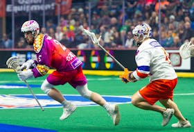 Halifax Thunderbirds defender Graeme Hossack (right) chases Toronto Rock forward Zach Manns during a National Lacrosse League game Saturday night at FirstOntario Centre in Hamilton, Ont. - CHRISTIAN BENDER / NLL 