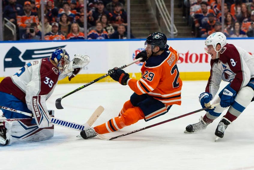 Edmonton Oilers’ Leon Draisaitl (29) is stopped by Colorado Avalanche goaltender Darcy Kuemper (35) during first period NHL action at Rogers Place in Edmonton, on Saturday, April 9, 2022.