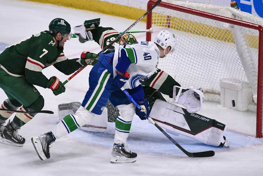  Vancouver Canucks centre Elias Pettersson scores against Minnesota Wild goalie Cam Talbot to put the visitors into a 3-2 lead in the second period Thursday in St. Paul, Minn.