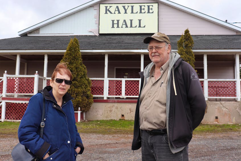 Charlene Martin, left, and Gary Fraser, who own the Kaylee Hall in Roseneath, P.E.I., say the time has come to sell the hall after several family members involved in the business have died. 
