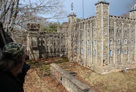 Bruce Richardson looks at the replica of the Tower of London, one of the two castles at the former Woodleigh Replicas, which he bought in August 2021.