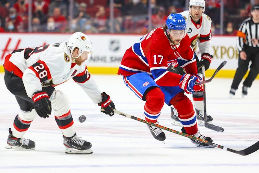 Montreal Canadiens Josh Anderson has the puck knocked off his stick by Ottawa Senators Connor Brown during first period of National Hockey League game in Montreal Tuesday April 5, 2022.