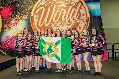 PCA team Givenchy holds a Cape Breton Island flag after its third-place finish at the Allstar World Championships in Florida on Friday. CONTRIBUTED/Premier Cheerleading All-Stars