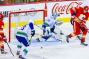  Apr 23, 2022; Calgary, Alberta, CAN; Vancouver Canucks goaltender Thatcher Demko (35) guards his net against the Calgary Flames during the first period at Scotiabank Saddledome.