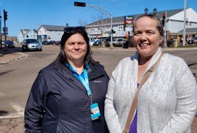 Christine Arsenault, left, orientation and mobility specialist with Vision Loss Rehabilitation Canada, and Jennifer Sanderson, a Summerside resident with vision impairment, on Water Street in Summerside. The city recently completed a review of its pedestrian pushbuttons in an effort to improve safety for people with vision impairment like Sanderson. 