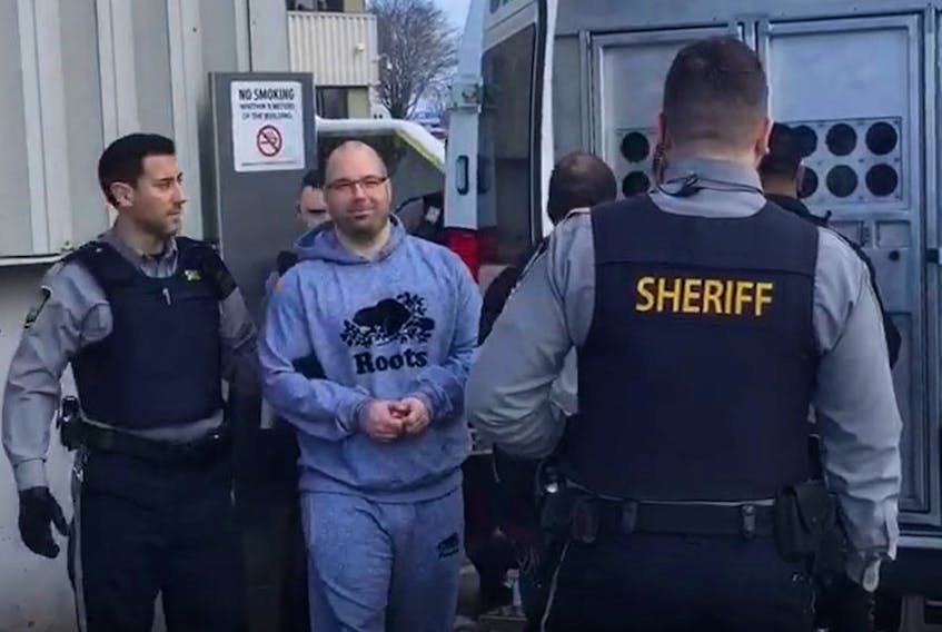 Brian James (B.J.) Marriott is escorted to a sheriff's van at the Dartmouth provincial courthouse in February 2020. Marriott, 39, is awaiting sentencing on a charge of aggravated assault in connection with a vicious attack on an inmate at the Dartmouth jail by a group of men in December 2019.