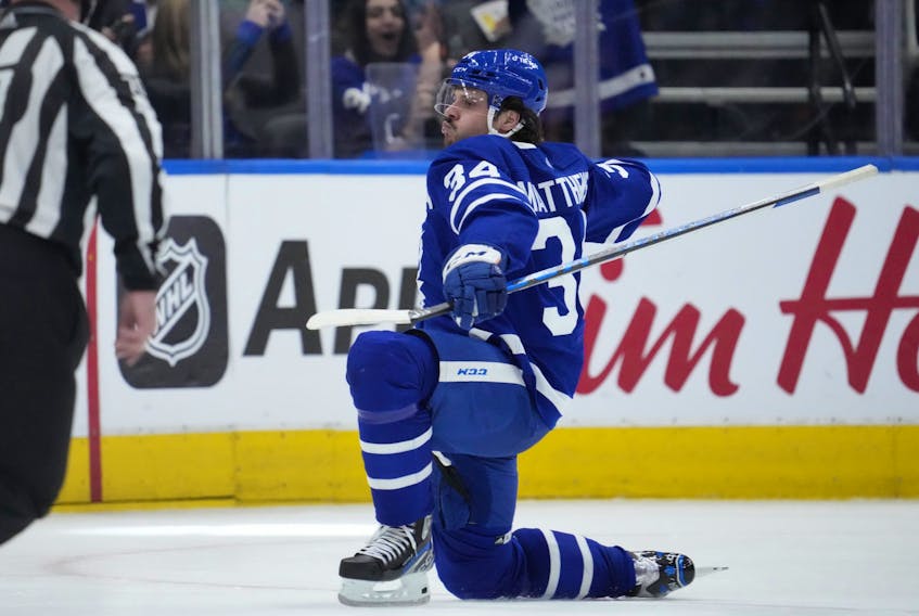 Toronto Maple Leafs centre Auston Matthews (34) celebrates after scoring his 60th goal of the season, in the third period against the Detroit Red Wings on Tuesday night at Scotiabank Arena.  